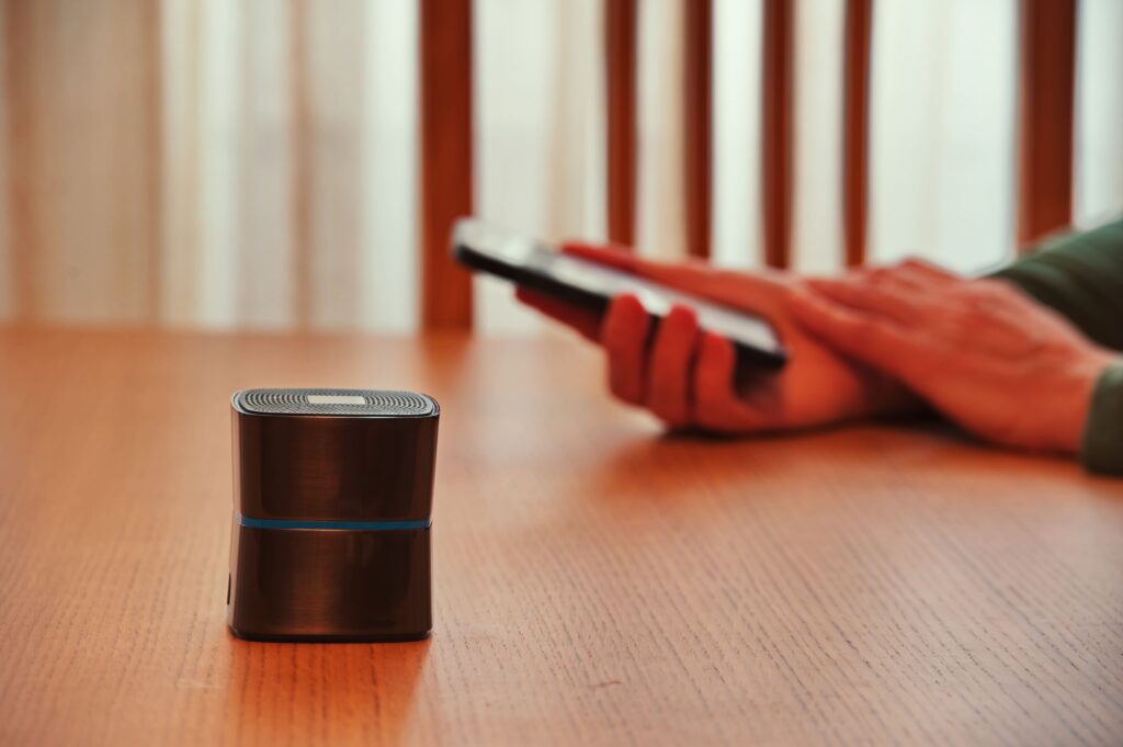 A voice-controlled smart device on a table, illustrating the role of voice search optimization in modern SEO strategies.