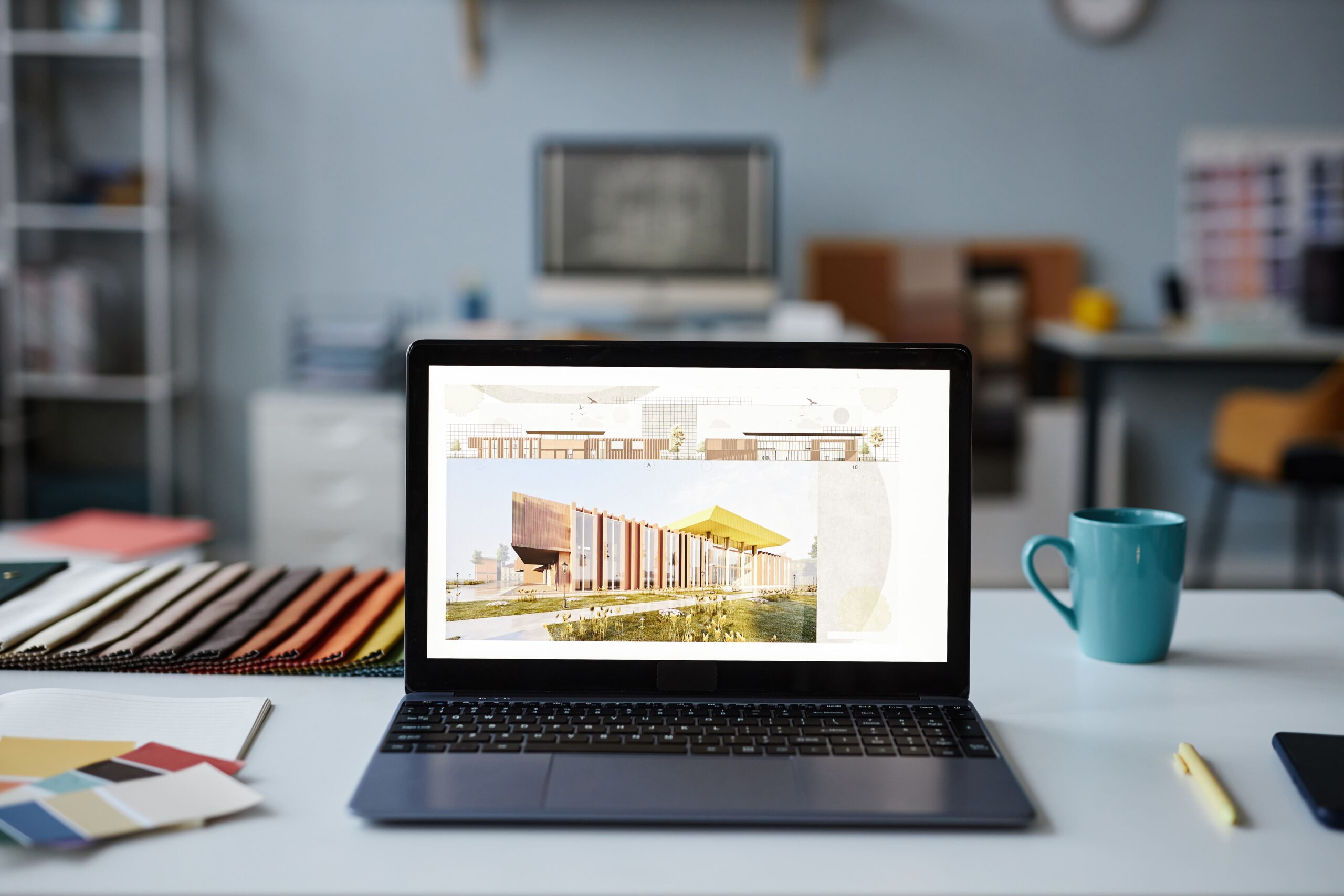 A laptop displaying an architectural design website, used to compare landing page vs homepage layout strategies.